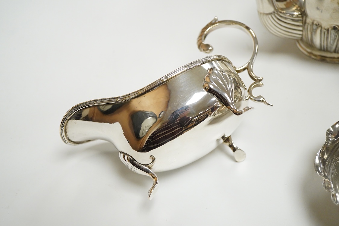 A 20th century continental 800 standard white metal hot water pot and cream jug (lacking cover and knop), gross weight 11.2oz, together with a plated teapot, sauceboat and bowl.